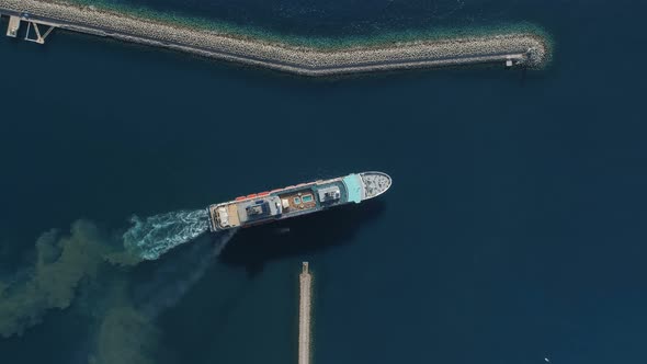 Aerial View of Luxury Medium Cruise Ship Sailing From Port