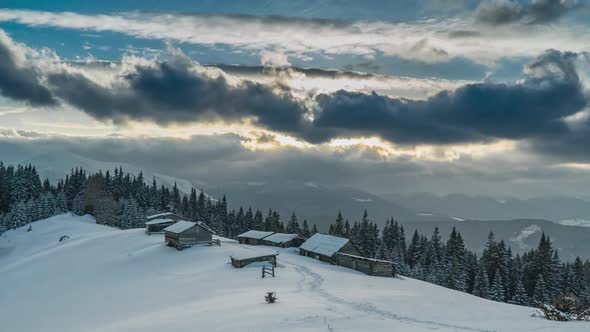 Clouds Move Over the Mountains and the Village of Shepherds in Winter alt