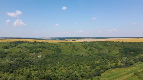 Aerial Landscape View of Yellow Cultivated Agricultural Field with Dry Straw of Cut Down Wheat After alt