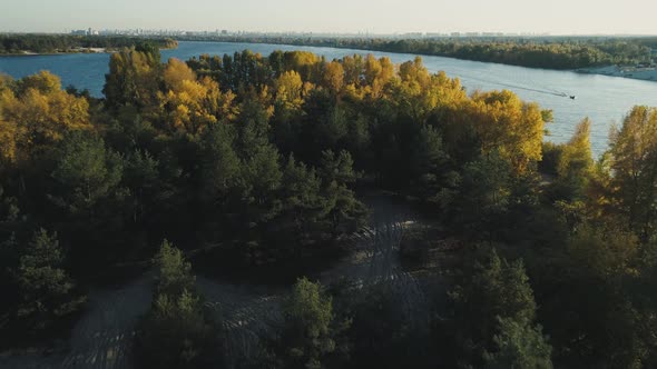 Aerial Drone Footage. Flight Over Island on Dnipro River with View on Kyiv City at Autumn Season
