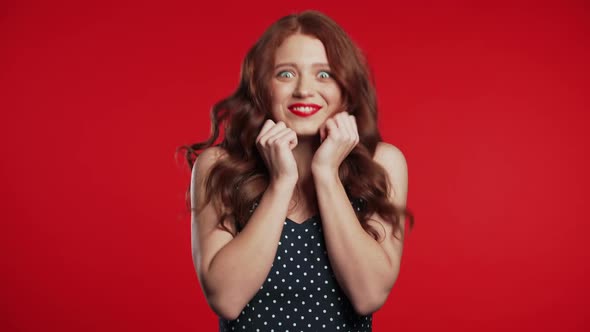 Girl with Red Hair Very Glad and Happy, She Smiling, Screaming and Jumping. alt