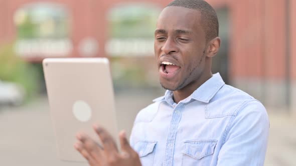 Outdoor Portrait of Video Call on Tablet By Attractive African Man alt