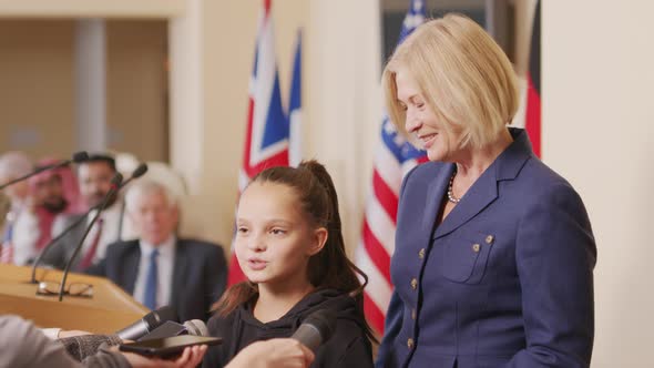 Little Environmental Activist Talking to Press at Conference alt