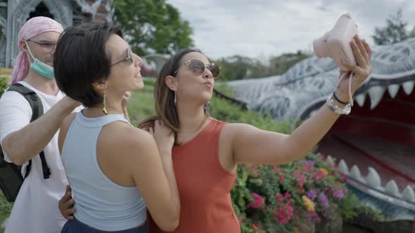 Tourists Making Selfie On Polaroid Camera At Ancient City Park In Thailand  Medium Shot alt