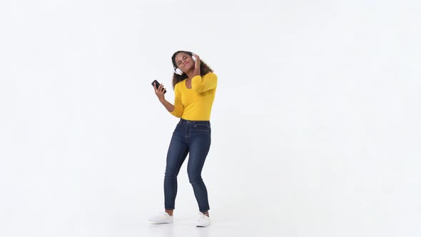African American young charming woman dancing and smiling joyfully