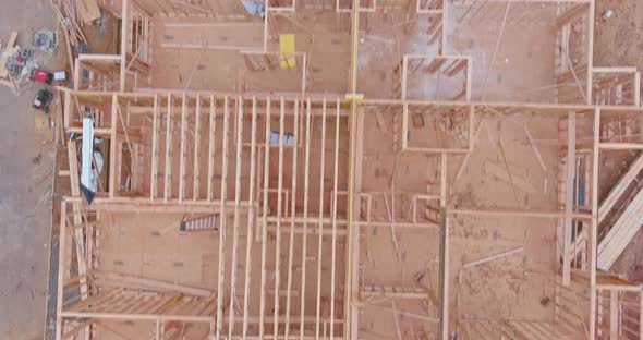 Wood building frame structure on a new development framing of new house under construction alt