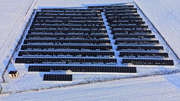 Alternative energy in Poland. Snowy solar panels in winter. alt