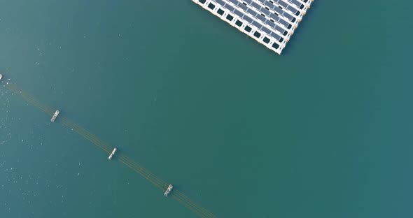 Aerial View of Floating Solar Panels Cell Platform System on the Pond alt