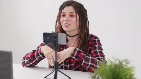Concept of Blogging and Video Broadcasts. Young Female Blogger Recording Video or Broadcast Live on alt
