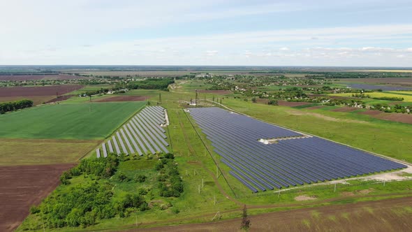 Drone Footage of a Massive Solar Power Station in a Field, Landscape,  alt