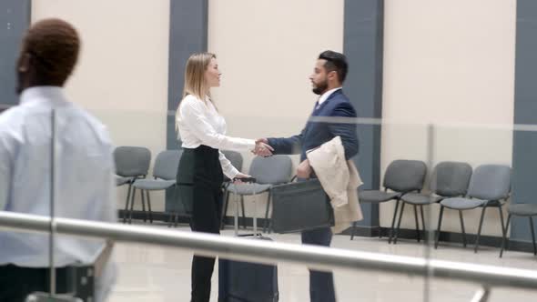 Businesswoman shaking hands her welcomer