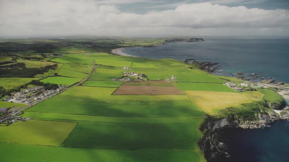 Hyperlapse Farmlands Fields Aerial View in Antrim County, Ireland. Fast-track Shot Above Countryside alt