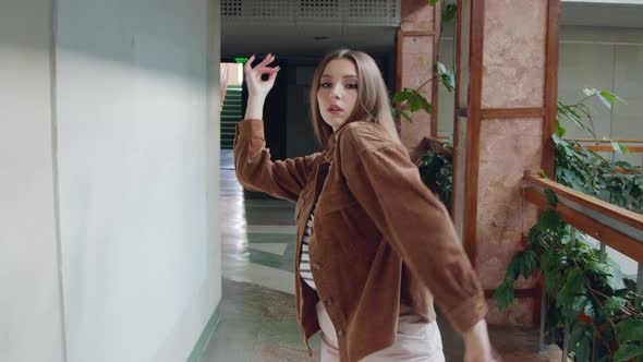 Young Woman Is Dancing In Hallway