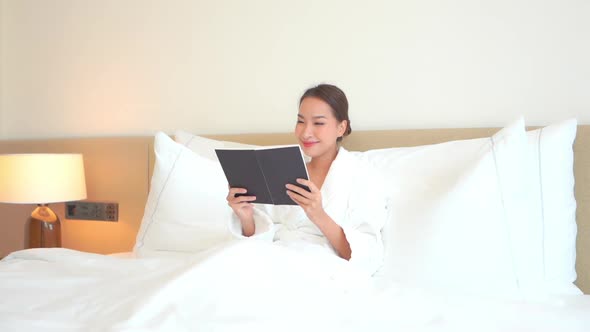 Young asian woman read book alt