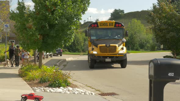 Children getting off from the school bus