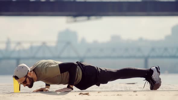 Man Limbering-Up And Stretching Legs After Running Jog Workout. Runner Stretching And Warming-Up. alt