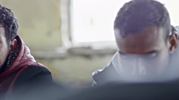 Sad Arab Man Thinking by Fire alt