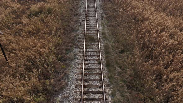 Above old railway track in prairie 4K aerial footage