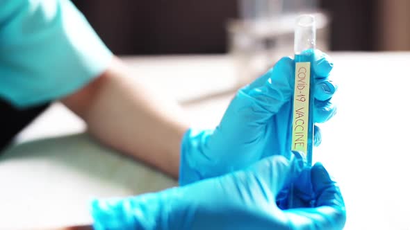 Doctor holding a coronavirus COVID-19 vaccine