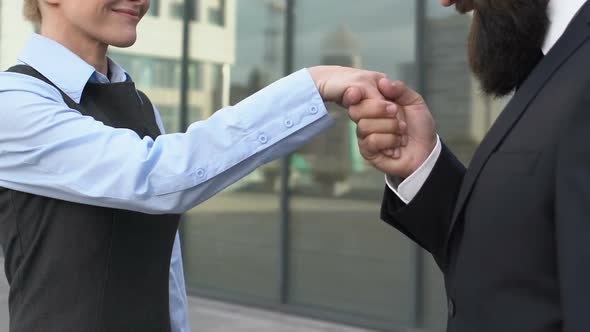 Woman Boss Shaking Hand With Male Partner Trying to Kiss Female Arm, Discontent