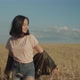 Joyful Asian Woman Walking in Wheat Field at Sunset - VideoHive Item for Sale