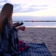 Beautiful Girl Drinking Coffee On The Beach In The Morning - VideoHive Item for Sale