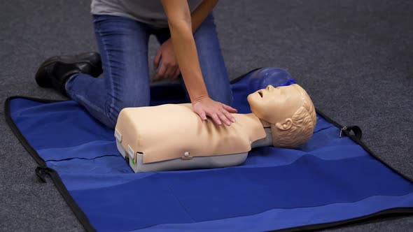 Infant CPR manikin first aid. Cardiopulmonary resuscitation and first aid for child alt