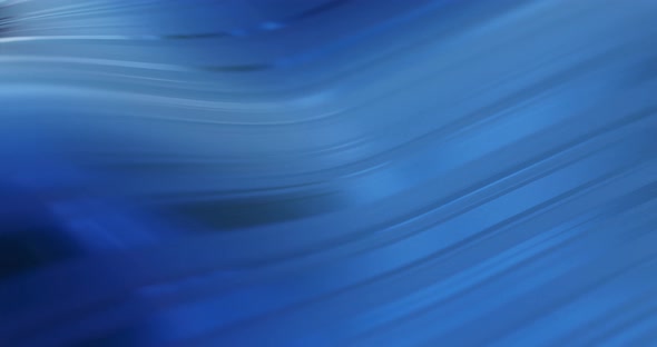 blue abstract motion background with curved lines, waves.