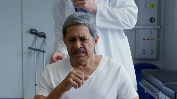 Medical professional and patient at a hospital alt