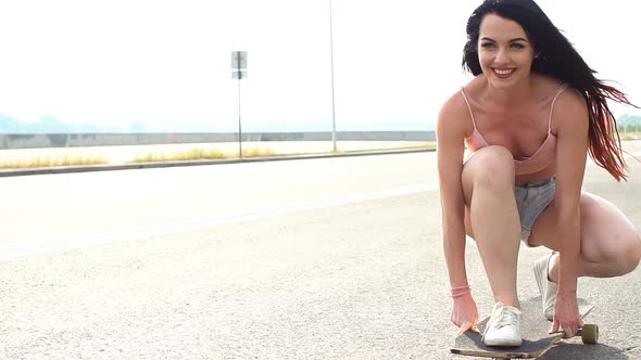 Attractive Hipster Girl Rides on Longboard, Slow Motion