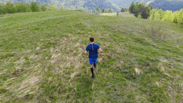 Runner Trains in the Mountains