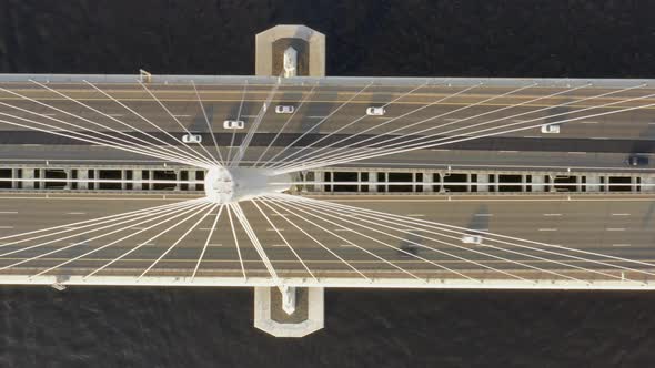 Aerial Top View of Cable-stayed Bridge with Cars alt