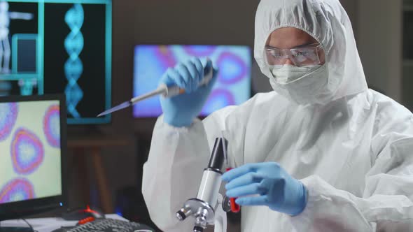 Asian Doctor In Protective Suit Is Doing A Science Experiments And Developing Vaccine alt