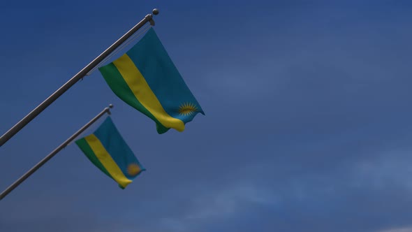 Rwanda Flags In The Blue Sky - 4K