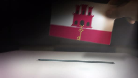 Gibraltar__election_box_hand.mov alt