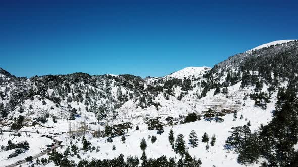 Moving over a snow covered mountain on a clear day