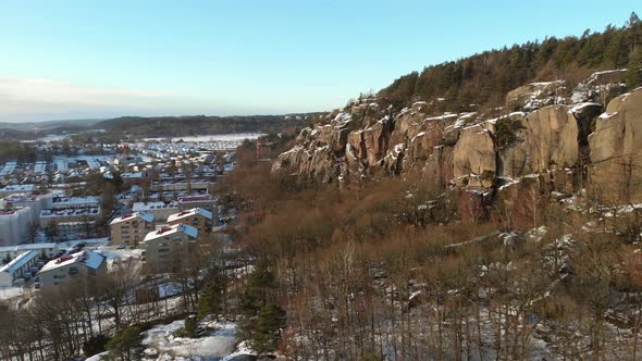 Mountain Wall Next to Detached House Neighbourhood Winter Aerial Reveal