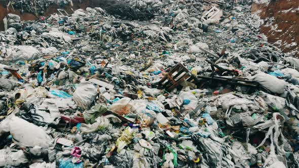 Dumping Site with Lots of Rubbish in the Snow alt