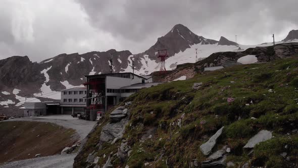 Kitzsteinhorn Alpine Center With Snowy Mountains At Background In Kaprun, Austria. - Aerial Tilt-Up alt