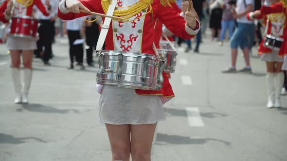 Young Girls Drummer in Red Vintage Uniform at the Parade alt
