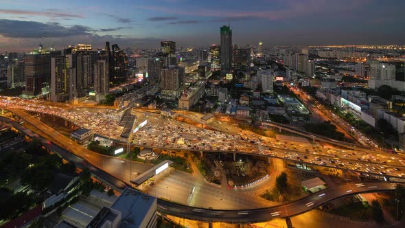 Day to night time lapse of aerial view of busy cars with traffic jam in rush hour on highway alt
