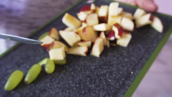 Young man mixing salad in the bowl alt