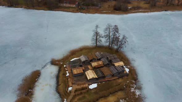 Araisi Lake Castle in Latvia Aerial Shot From Above. Historical Wooden Buildings on Small Island in alt