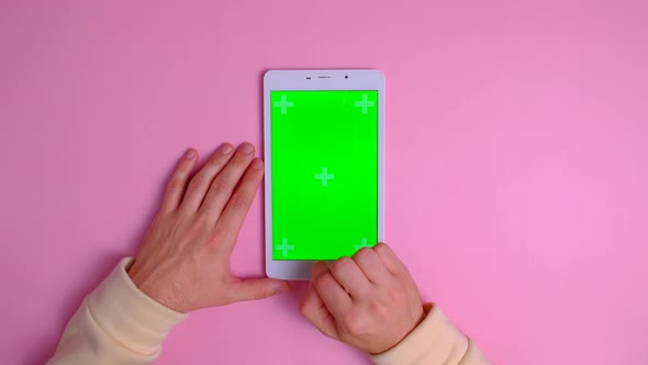 Man Using Smartphone with Green alt