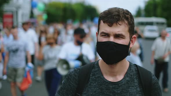 Protester Man in Covid Facemask Walking in Restrictions Opposition People Crowd