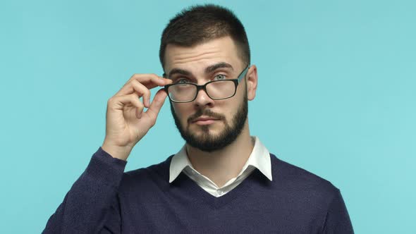 Close Up of Handsome Male Entrepreneur Takeoff Glasses and Looking Surprised at Camera Blink Fast