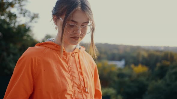 Thoughtful Girl Who Admires Nature and Types a New Article for the Diary alt