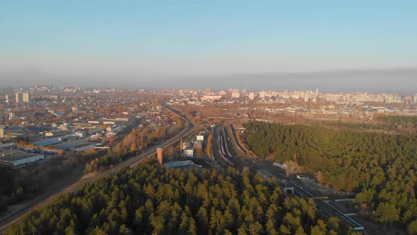 Aerial View of Winter Forest and City