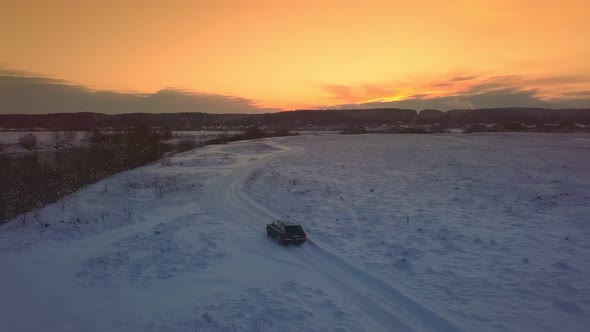 Drone shooting of river against background of a forest and a bridge, a car alt