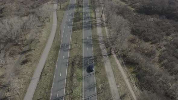 A aerial view of a Jaguar f-type driving off road, Netherlands. alt